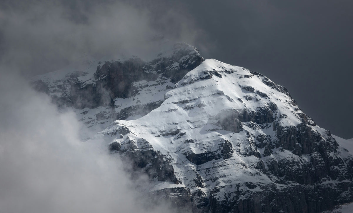Snowy mountain peak in the mist